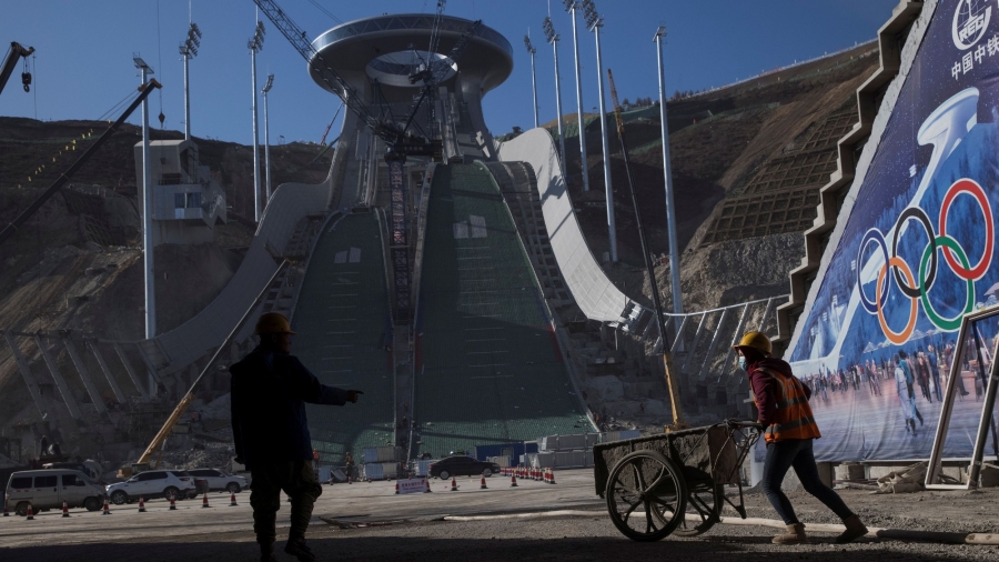 Laborers work at the construction site of the ski jump arena of the 2022 Winter Olympics in the Chongli district of Zhangjiakou, Hebei province, China, Oct. 29, 2020.