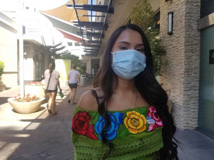 Carla Retana, in Phoenix, Arizona on Nov. 3, said she voted for Biden mostly because she doesn’t like how Trump speaks, especially about women. A portrait of a young Latina woman.