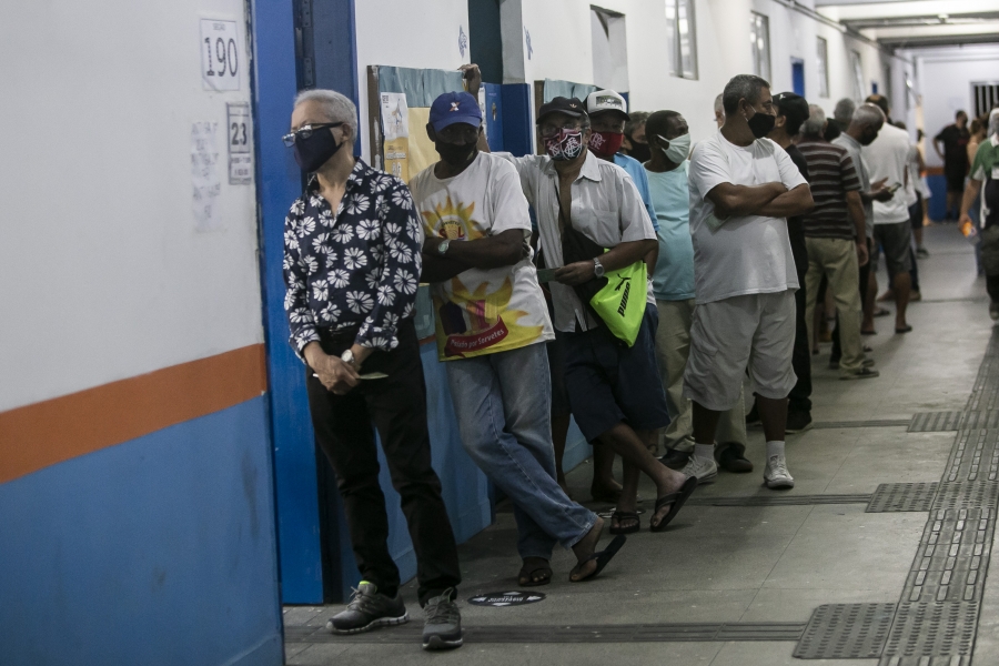 Rio de Janeiro residents line up to vote for city council and mayor Nov. 29. A group of voters in line.