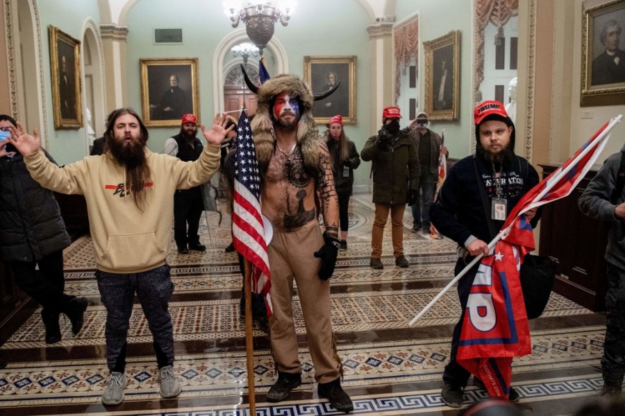 Among the crowd that stormed the U.S. Capitol on Jan. 6 were QAnon supporters. Among the crowd that stormed the U.S. Capitol on Jan. 6 were QAnon supporters.