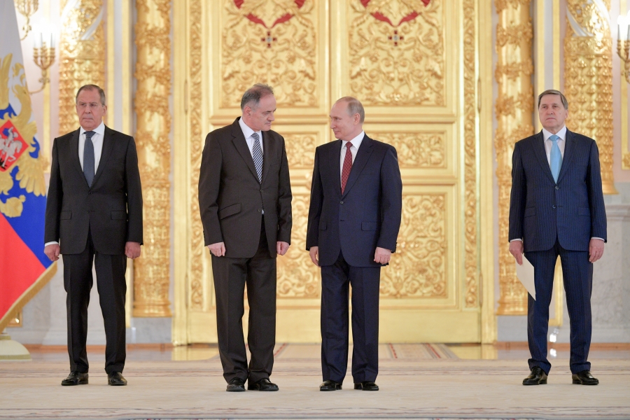 Montenegro’s ambassador to Russia meets Vladimir Putin in 2018. The two countries have longstanding ties. Four men stand in a line – the two in the middle at Montenegro's ambassador to Russia and Vladimir Putin