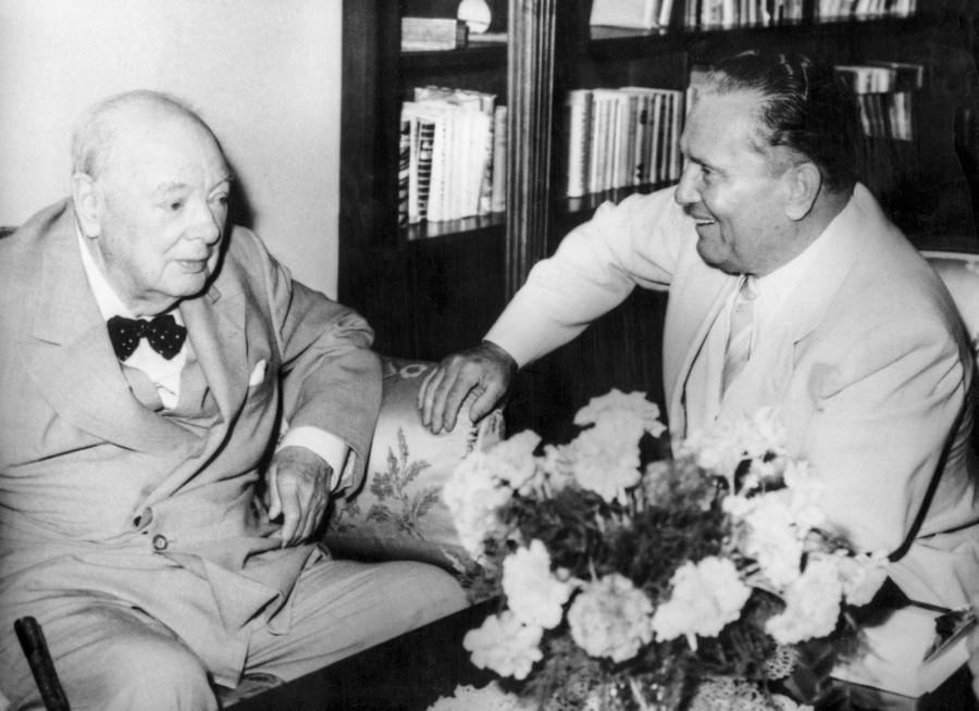 Wartime leaders Tito, right, and Winston Churchill, in Split, Yugoslavia, in 1960. A candid photo of two men sitting next to each other and talking.