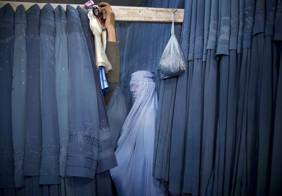 An Afghan woman waits in a changing room to try out a new Burqa, in a shop in the old city of Kabul, Afghanistan, on April 11, 2013. Before the Taliban took power in Afghanistan, the Burqa was infrequently worn in cities. While they were in power, the Tal An Afghan woman waits in a changing room to try out a new Burqa, in a shop in the old city of Kabul, Afghanistan, on April 11, 2013. Before the Taliban took power in Afghanistan, the Burqa was infrequently worn in cities. While they were in power, the Tal
