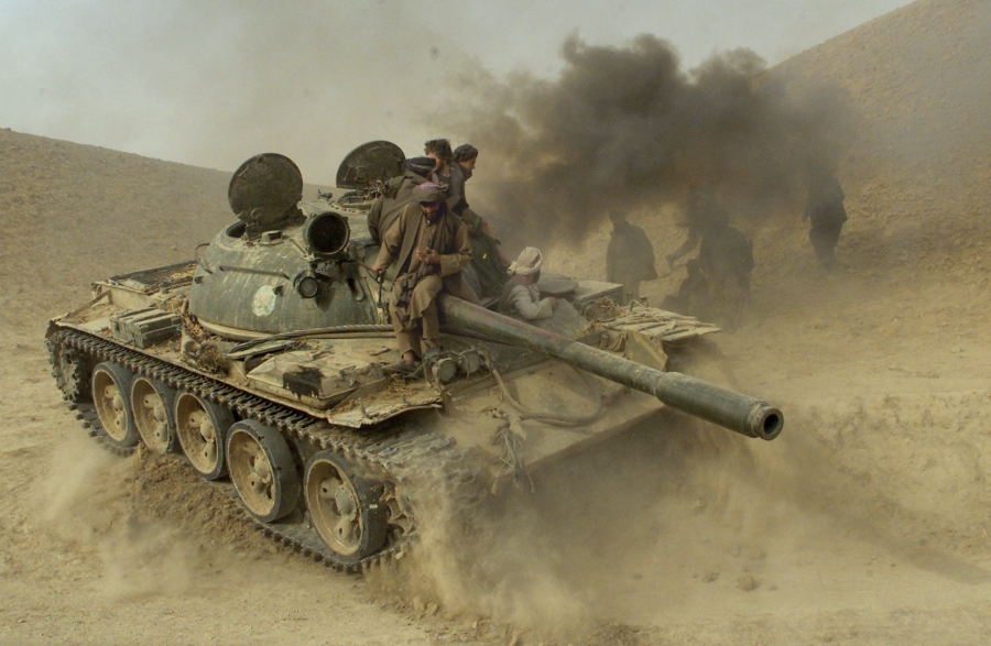 Defecting Taliban fighters maneuver a tank through the front line near the village of Amirabad, between Kunduz and Taloqan, on Nov. 24, 2001. Defecting Taliban fighters maneuver a tank through the front line near the village of Amirabad, between Kunduz and Taloqan, on Nov. 24, 2001.