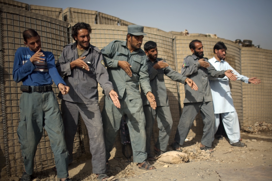 Afghan policemen simulate weapons orientation during a training session with U.S. soldiers from 2nd PLT Diablos 552nd Military Police Company, on the outskirts of Kandahar City, Afghanistan, on Oct. 26, 2010. Afghan policemen simulate weapons orientation during a training session with U.S. soldiers from 2nd PLT Diablos 552nd Military Police Company, on the outskirts of Kandahar City, Afghanistan, on Oct. 26, 2010.