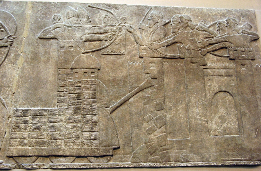 Assyrian attack on a town with archers and a wheeled battering ram; from a relief dated 865–860 BC, taken from the North-West Palace of Nimrud; now in the British Museum. Assyrian attack on a town with archers and a wheeled battering ram; from a relief dated 865–860 BC, taken from the North-West Palace of Nimrud; now in the British Museum.