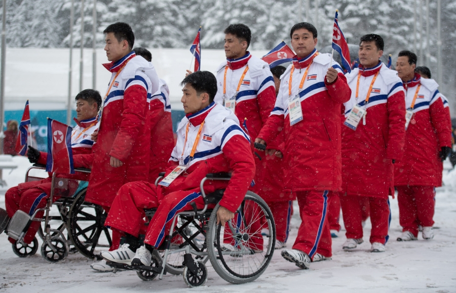 The delegation and the team of North Korea arrive at The Paralympic Village in Pyeongchang, South Korea, March 8, 2018. The delegation and the team of North Korea arrive at The Paralympic Village in Pyeongchang, South Korea, wearing red jumpsuits, March 8, 2018.