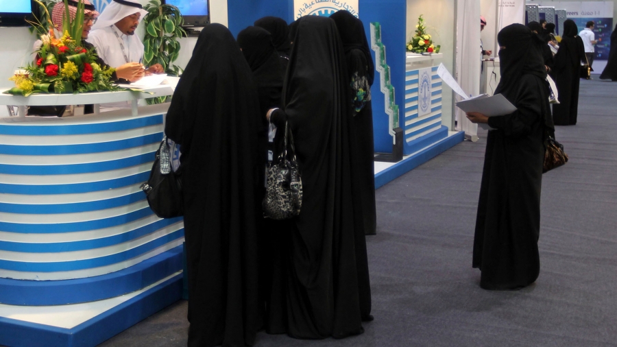 Saudi Arabian women, seeking a job, talk with recruiters during a job fair in Riyadh. Saudi Arabian women, seeking a job, talk with recruiters during a job fair in Riyadh.