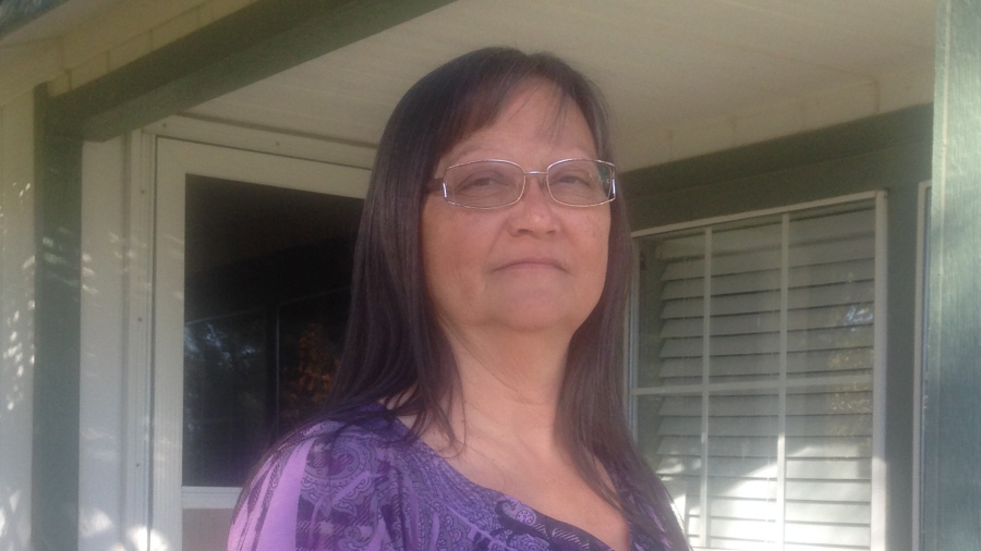 A woman looks at camera