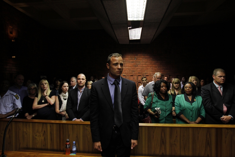 Oscar Pistorius awaits the start of court proceedings