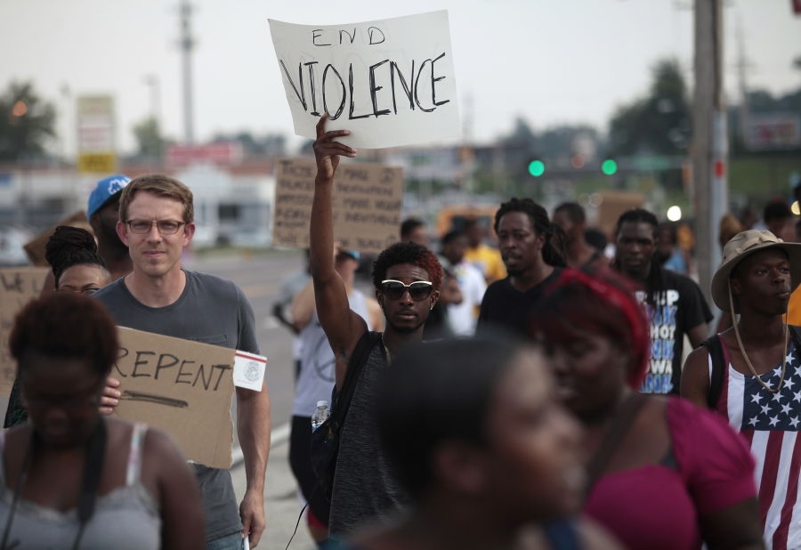 Demonstrators protest against the shooting death of Michael Brown in Ferguson, Mo., on August 18, 2014. Demonstrators protest against the shooting death of Michael Brown in Ferguson, Mo., on August 18, 2014.