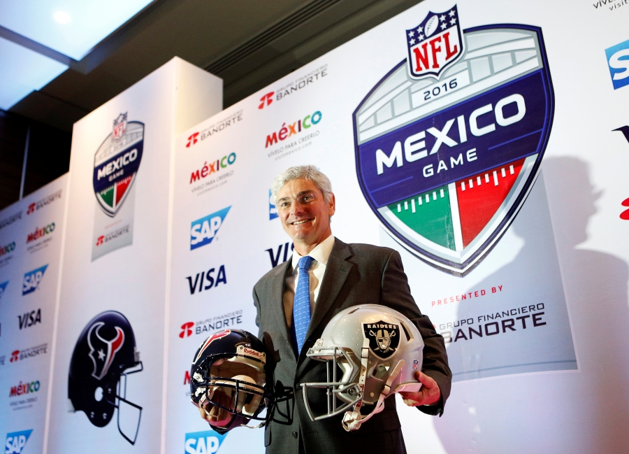 Representative of the National Football League (NFL) Arturo Oliver shows football helmets to the media to promote the regular season game between Houston Texans and Oakland Raiders, in Mexico City, Mexico July 19, 2016. Representative of the National Football League (NFL) Arturo Oliver shows football helmets to the media to promote the regular season game between Houston Texans and Oakland Raiders, in Mexico City, Mexico July 19, 2016.