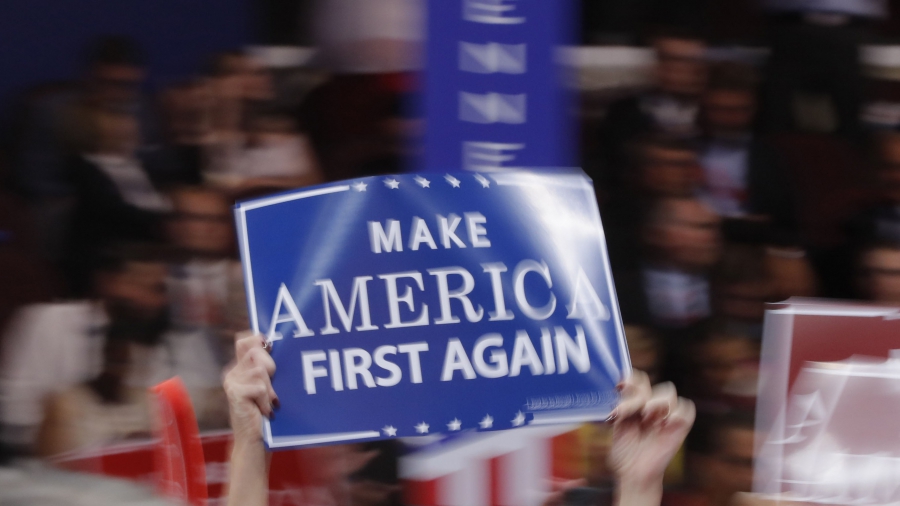 A delegate waves a "Make America First Again" sign at the Republican National Convention in Cleveland, Ohio, in July A delegate waves a "Make America First Again" sign at the Republican National Convention in Cleveland, Ohio, in July