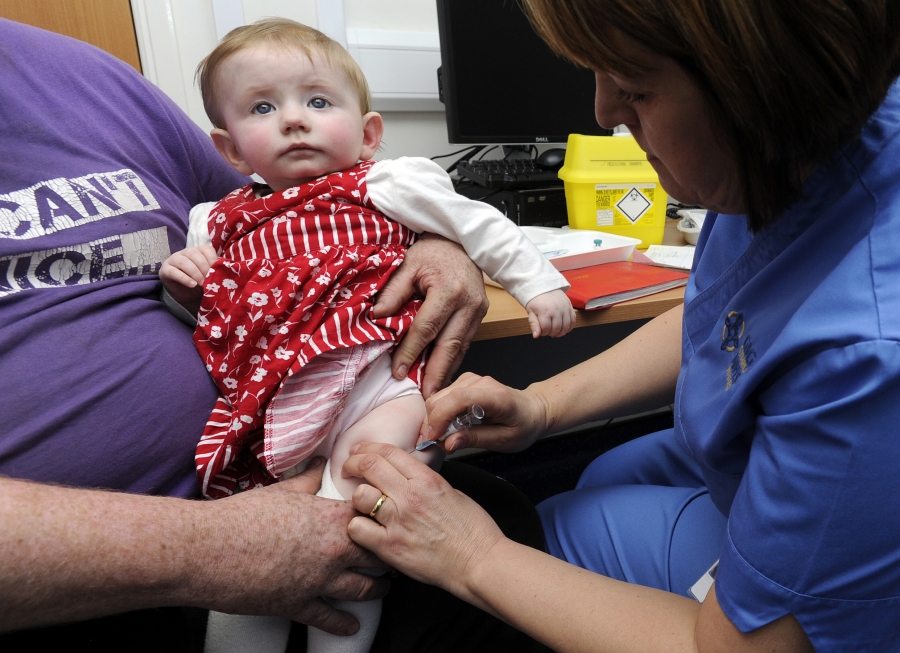 Ten-month old Lauren Durbin receives an injection for measles, mumps and rubella. Typically children do not receive the MMR vaccine until they are 12 months old. Ten-month old Lauren Durbin receives an injection for measles, mumps and rubella. Typically children do not receive the MMR vaccine until they are 12 months old.