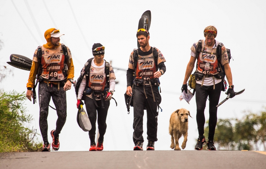 Team Peak Performance walks with stray dog Arthur during a stage of the 430-mile Adventure Racing World Championship. Team Peak Performance walks with stray dog Arthur during a stage of the 430-mile Adventure Racing World Championship.