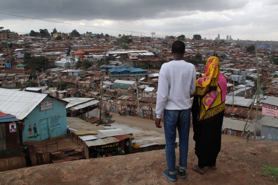 Ben and Salma are Kenyan students studying journalism at the Nairobi community news hub, Habari Kibra. They are looking out over their home town, Kibera, one of the largest slums in the world. Ben and Salma are Kenyan students studying journalism at the Nairobi community news hub, Habari Kibra. They are looking out over their home town, Kibera, one of the largest slums in the world.
