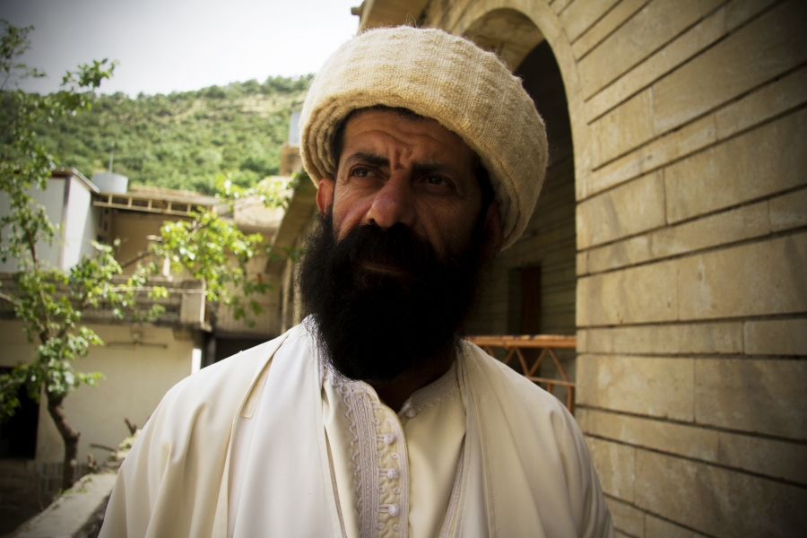 Baba Chawish, a Yezidi spiritual leader at Lalish temple, explains that before the Islamic State crisis, women who had been raped or forced to convert were traditionally cast out of Yezidi society. But now they can still be purified and baptized. Baba Chawish, a Yezidi spiritual leader at Lalish temple, explains that before the Islamic State crisis, women who had been raped or forced to convert were traditionally cast out of Yezidi society. But now they can still be purified and baptized.