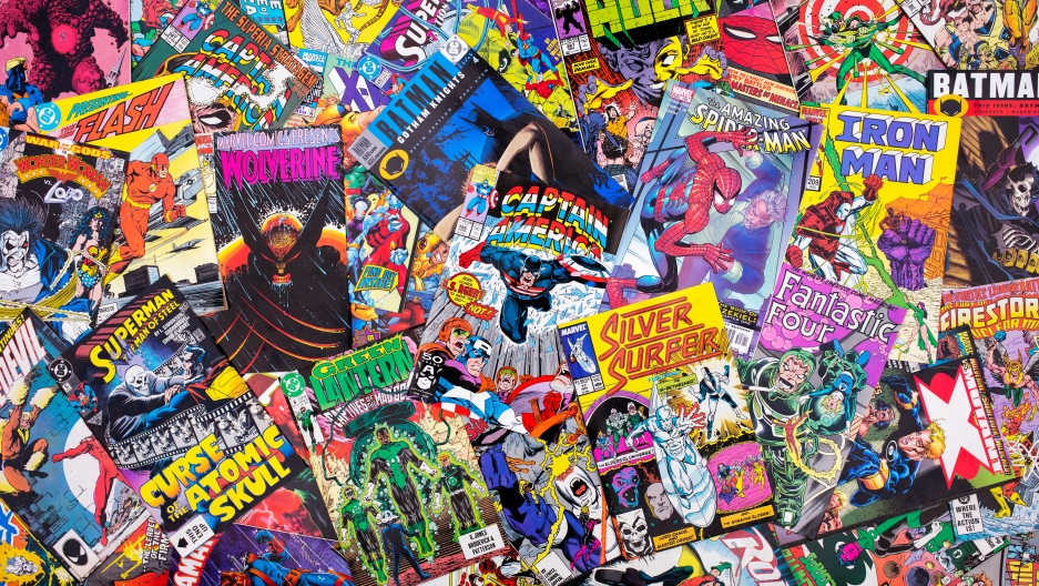 A pile of Marvel and DC comics. A pile of Marvel and DC comics.