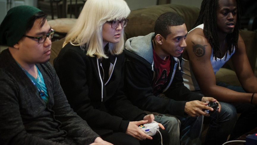 Two two-person teams battle each other in Super Smash Brothers Melee for practice.