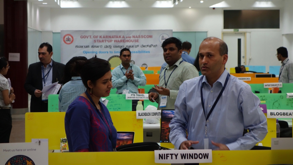 Indian startup entrepreneurs pitch their ideas to potential investors at the Startup Warehouse in Bangalore