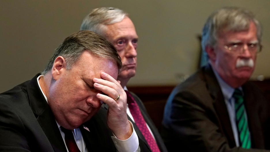 From left, Secretary of State Mike Pompeo, Secretary of Defense James Mattis and national security adviser John Bolton attend a meeting at the White House, May 17, 2018. Secretary of State Mike Pompeo is shown with his face in his hand.
