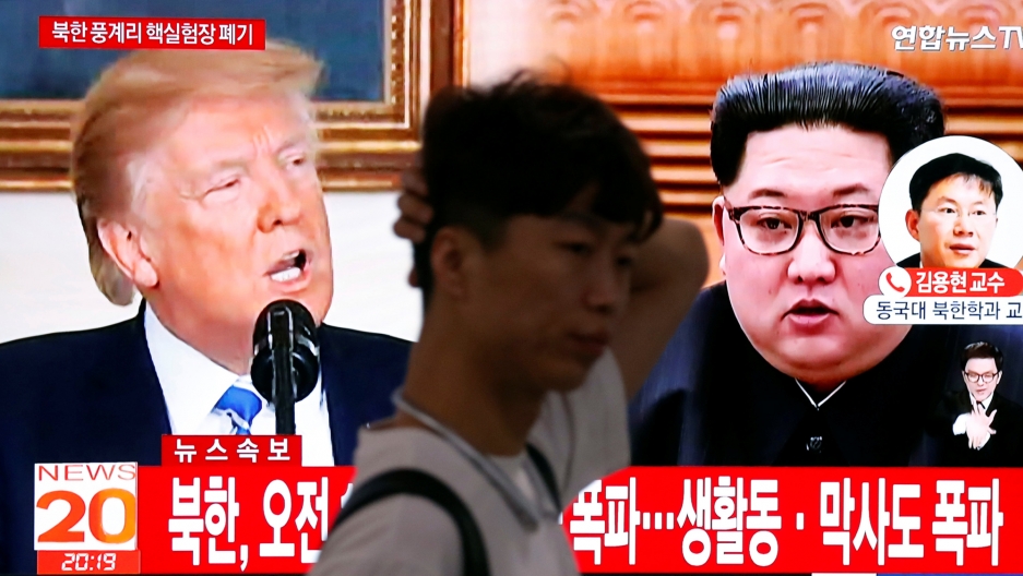 A man walks past a TV showing US President Donald Trump and North Korean leader Kim Jong-un, in Seoul, May 24, 2018. A man walks past a TV showing US President Donald Trump and North Korean leader Kim Jong-un, in Seoul, May 24, 2018.