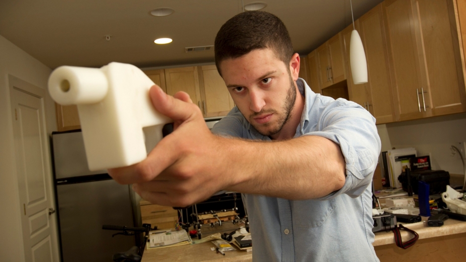Cody Wilson shows off his 3D-printed handgun at his home in Austin, TX, 2013. Cody Wilson shows off his 3D-printed handgun at his home in Austin, TX, 2013.