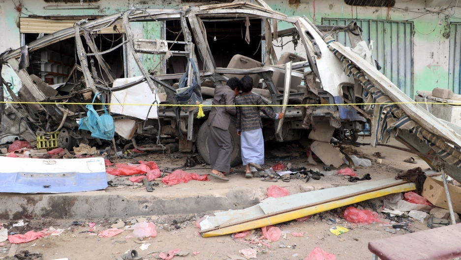 Boys inspect the wreckage of a bus at the scene of Thursday's air strike in Saada province, Yemen August 10, 2018. Boys inspect the wreckage of a bus at the scene of Thursday's air strike in Saada province, Yemen August 10, 2018.