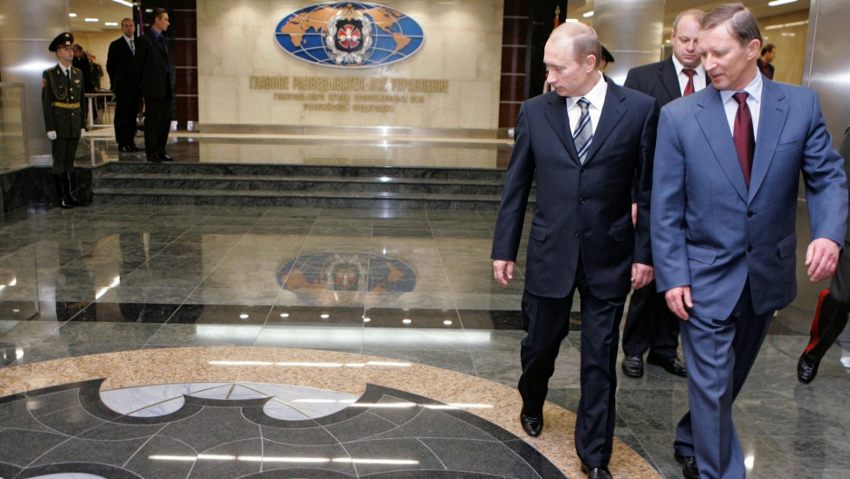 Russian President Vladimir Putin and Defense Minister Sergei Ivanov visit the new GRU military intelligence headquarters building in Moscow, Russia. Russian President Vladimir Putin and Defense Minister Sergei Ivanov are shown walking past a marble floor depicting a bat at the new GRU military intelligence headquarters building in Russia.