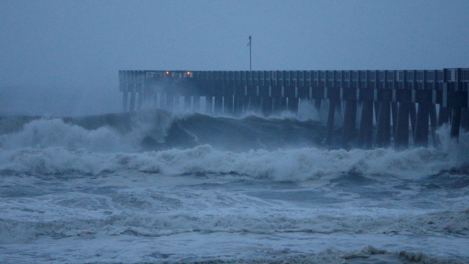 Waves crash along a pier as Hurricane Michael approaches Panama City Beach, Florida, Oct. 10, 2018. Large waves crash along a pier as Hurricane Michael approaches Panama City Beach, Florida.
