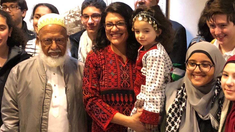 Congresswoman Rashida Tlaib (D-MI), the first Palestinian-American elected to the House, poses in her Palestinian thobe, surrounded by friends and family