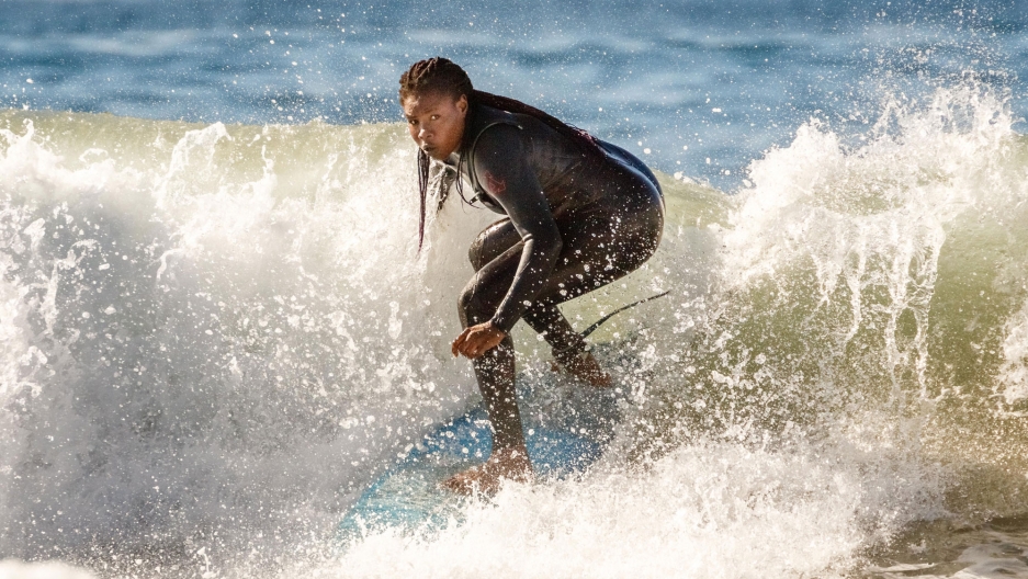 A woman on a surfboard