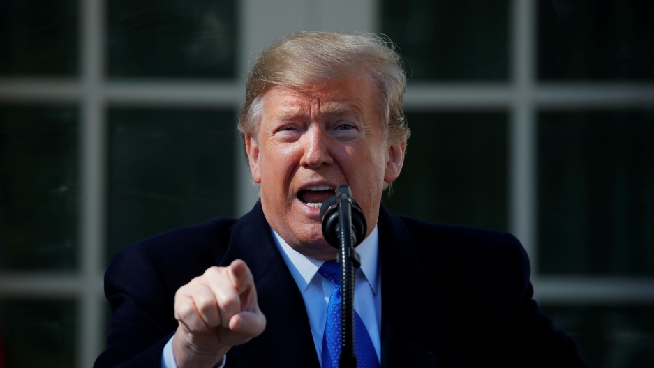 President points directly to the camera during a speech.