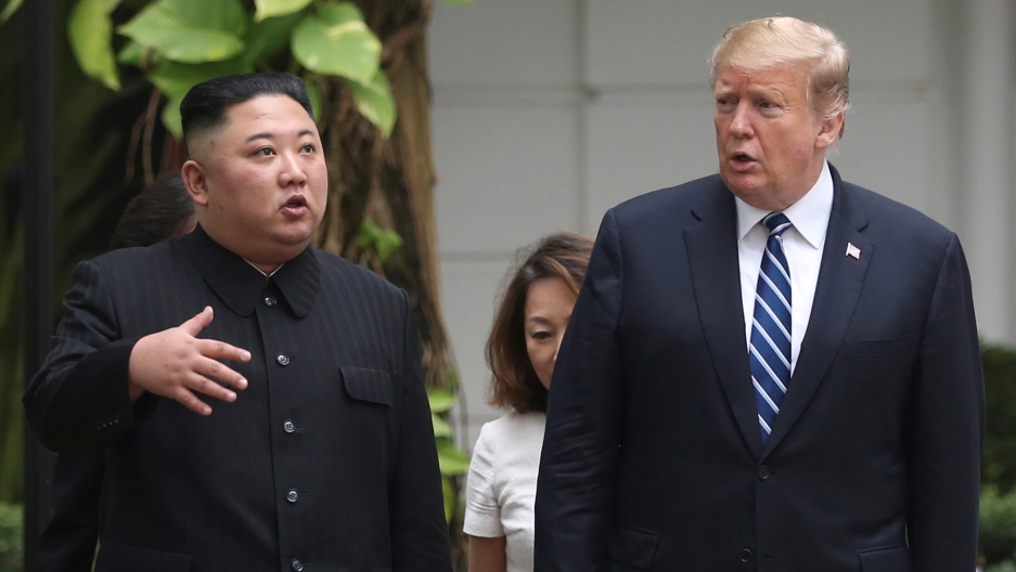North Korea's leader Kim Jong-un and US President Donald Trump stand side by side in the garden