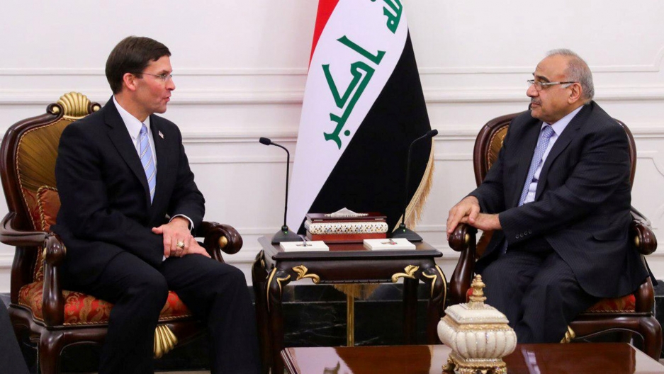 Iraqi Prime Minister Adel Abdul Mahdi meets with US Defense Secretary Mark Esper in Baghdad, Iraq Oct. 23, 2019. Iraqi Prime Minister Adel Abdul Mahdi is shown sitting across from US Defense Secretary Mark Esper with the Iraqi flag behind them.
