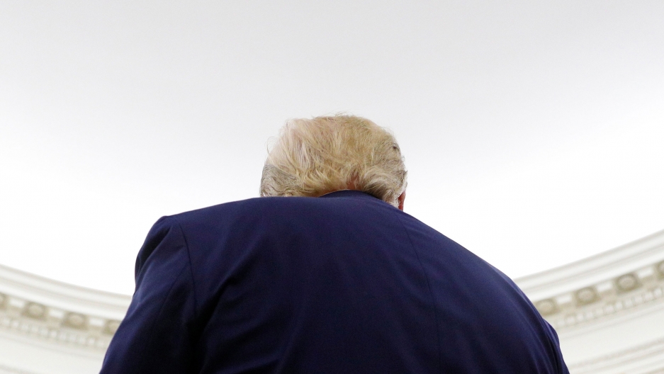 US President Donald Trump at the White House in Washington, Oct. 24, 2019. US President Donald Trump is shown from behind and wearing a dark blue suit jacket.