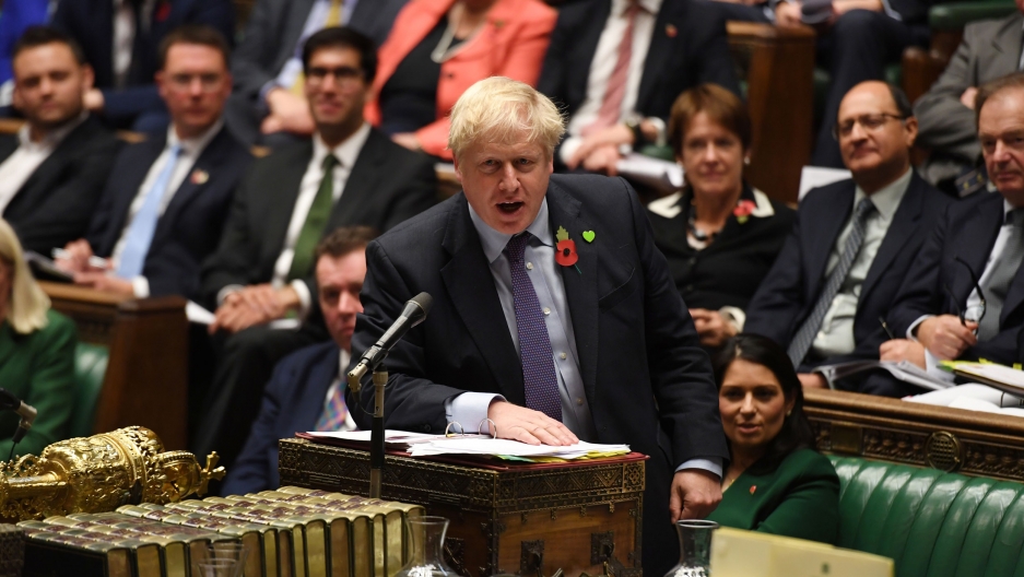 Britain's Prime Minister Boris Johnson speaks at the House of Commons in London, Britain, Oct. 30, 2019. Britain's Prime Minister Boris Johnson is shown at a podium speaking with his right hand resting on the podium.