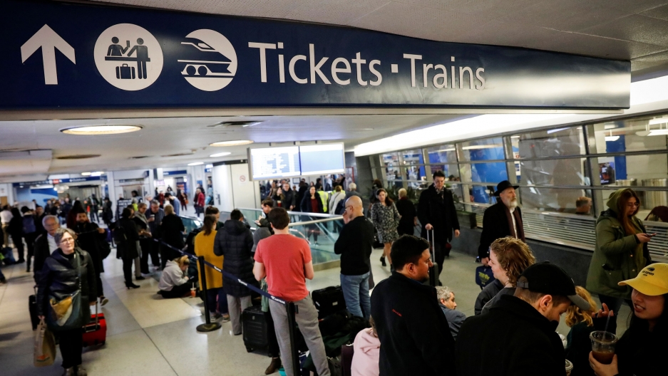 Travelers wait in the boarding area for trains during the Thanksgiving holiday travel rush at Pennsylvania Station in New York, on Nov. 27, 2019. Travelers wait in the boarding area for trains during the Thanksgiving holiday travel rush at Pennsylvania Station in New York, US, on Nov. 27, 2019.