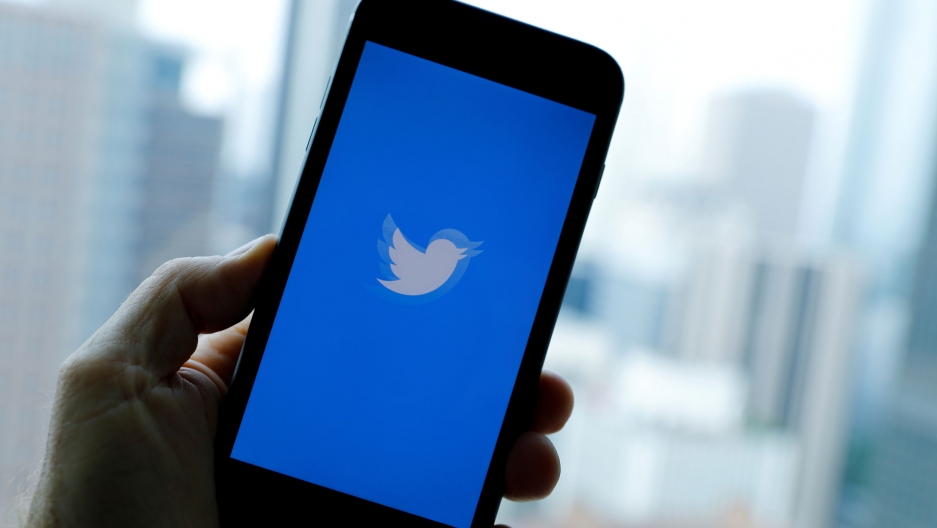 The Twitter app loads on an iPhone in this illustration photograph. A close-up photo of an iPhone launching the blue Twitter app.