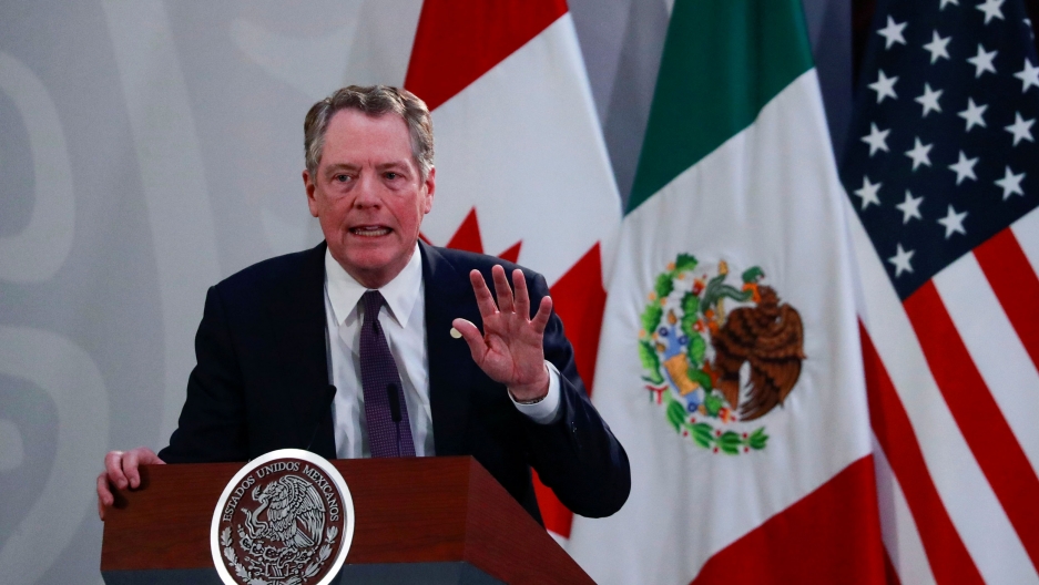 US Trade Representative Robert Lighthizer gestures as he speaks during a meeting at the Presidential Palace in Mexico City on Dec. 10, 2019. US Trade Representative Robert Lighthizer is shown speaking from a podium with the US, Mexico and Canadian flags behind him.