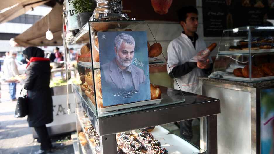 A picture of Iranian Maj. Gen. Qasem Soleimani, who was killed in an airstrike at Baghdad airport, is seen at a confectionery shop in Tehran, Iran, Jan. 7, 2020. A portrait painint of of Iranian Maj. Gen. Qasem Soleimani is shown on a glass case in a confectionery shop.
