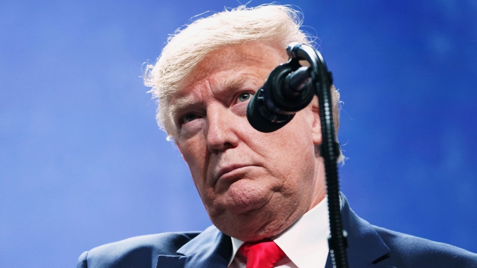US President Donald Trump speaks at the American Farm Bureau Federation's Annual Convention and Trade Show in Austin, Texas, Jan. 19, 2020. US President Donald Trump is shown standing behind a microphone and wearing a blue suit and red tie.