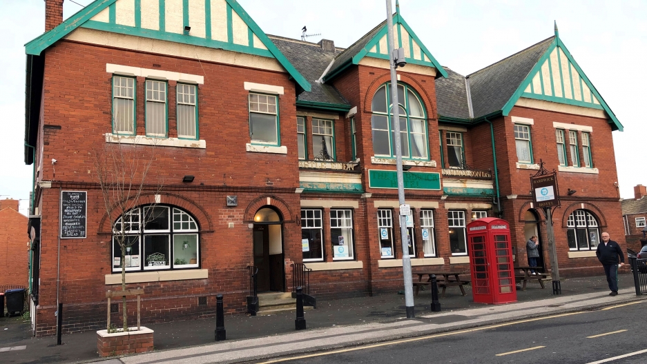 A view of the Hardwick Hotel pub in Blackhall Colliery, where, since 2014, 13 packages of 20-pound notes have been dumped in plain sight in the streets of County Durham village. A view of the red-brick building of the Hardwick Hotel pub in Blackhall Colliery is shown from across the street.