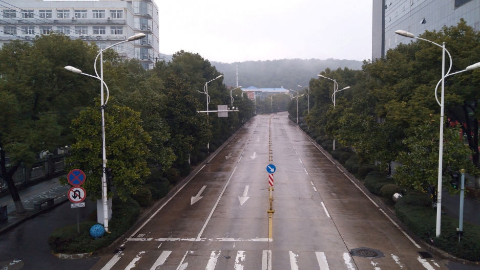 An empty street is seen in Wuhan, China, in this picture obtained from social media, Jan. 25, 2020. An empty four-lane street is shown with trees on either side.