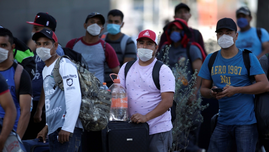 Migrants seeking for a U.S. work visa are pictured after being evicted from their hotel, which local authorities said was crowded, as part of the measures to prevent the spreading of the coronavirus disease (COVID-19), in Monterrey, Mexico March 24, 2020. Migrants seeking for a U.S. work visa are pictured after being evicted from their hotel, which local authorities said was crowded, as part of the measures to prevent the spreading of the coronavirus disease (COVID-19), in Monterrey, Mexico March 24, 2020.