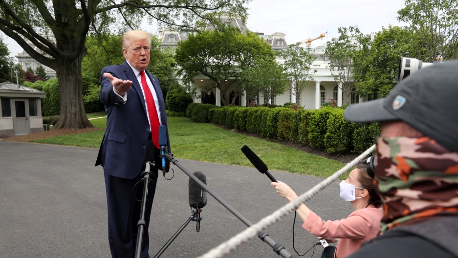 US President Donald Trump speaks to reporters as he departs the White House for travel to Michigan during the coronavirus disease (COVID-19) outbreak in Washington, DC, on May 21, 2020. US President Donald Trump speaks to reporters as he departs the White House for travel to Michigan during the coronavirus disease (COVID-19) outbreak in Washington, DC, on May 21, 2020.