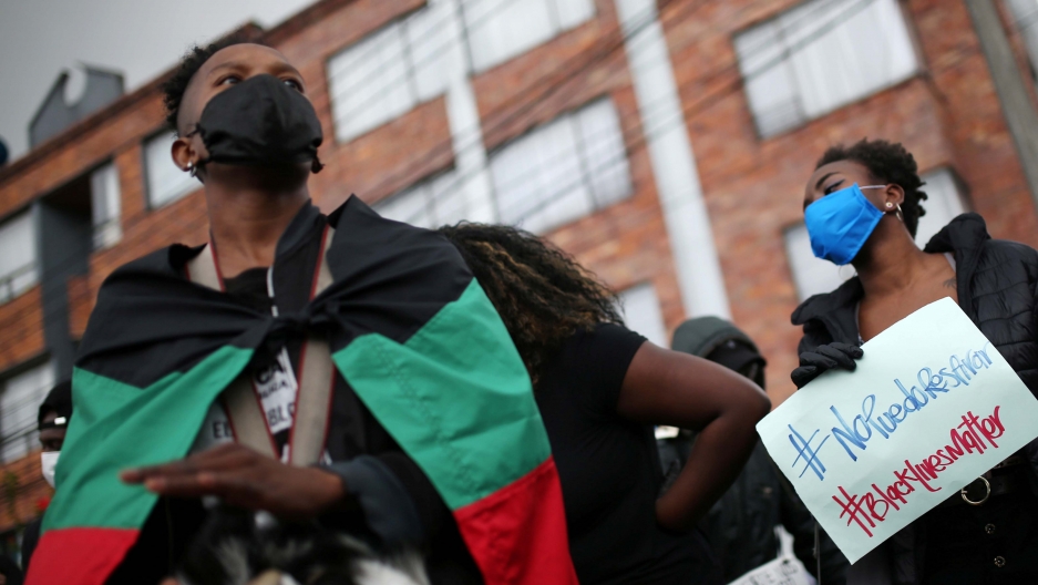 A demonstrator during a protest against the death in Minneapolis police custody of George Floyd and the arrival of US troops in Colombian territory, in Bogota, Colombia, on June 3, 2020. A demonstrator during a protest against the death in Minneapolis police custody of George Floyd and the arrival of US troops in Colombian territory, in Bogota, Colombia, on June 3, 2020.