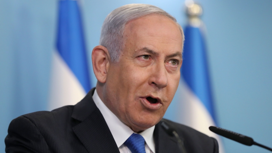 Israeli Prime Minister Benjamin Netanyahu announces full diplomatic ties will be established with the United Arab Emirates, during a news conference on Thursday, Aug. 13, 2020 in Jerusalem. Israeli Prime Minister Benjamin Netanyahu is shown wearing a dark suit and blue tied while speaking into a microphone.
