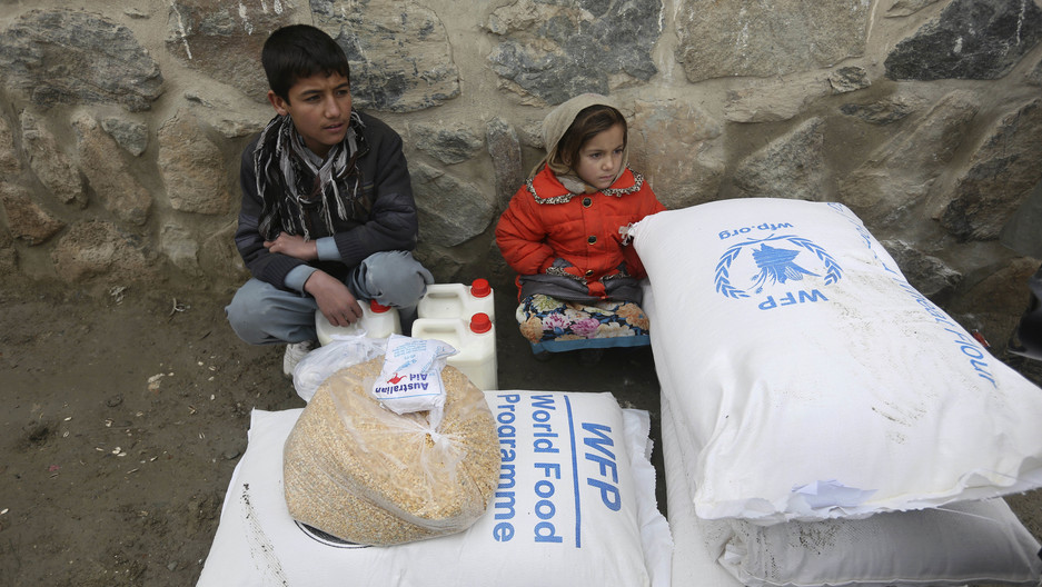 In this Jan. 24, 2017 file photo, children wait for transportation after receiving food donated by the World Food Program, in Kabul, Afghanistan. In this Jan. 24, 2017 file photo, children wait for transportation after receiving food donated by the World Food Program, in Kabul, Afghanistan.