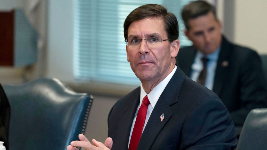 Secretary of Defense Mark Esper speaks before a meeting with Israeli Defense Minister Benny Gantz, at the Pentagon, Washington DC, Sept. 22, 2020. Secretary of Defense Mark Esper is shown seated a table with his hands clasped.
